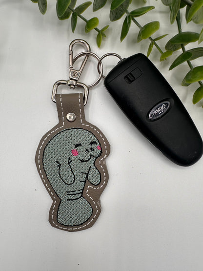 Manatee embroidered leather keychain