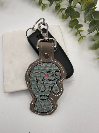 Manatee embroidered leather keychain