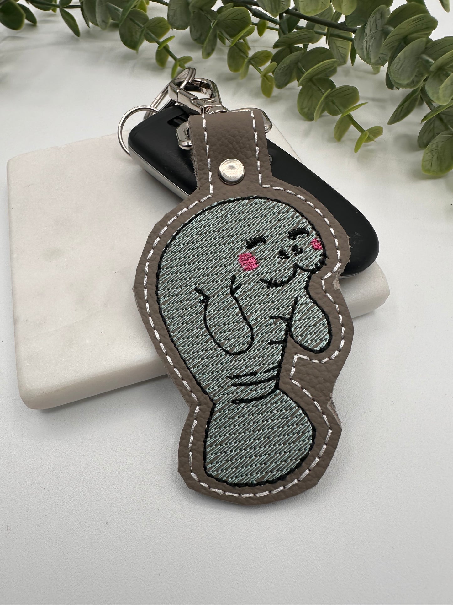 Manatee embroidered leather keychain