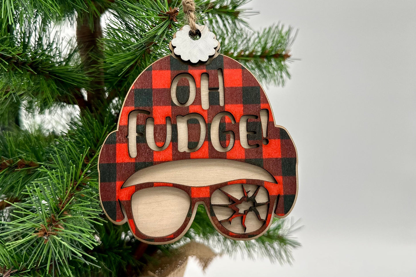 Oh Fudge Christmas Ornament - Handmade wooden with buffalo check hat, and cracked glasses. Character scene from a nostalgic Christmas story.